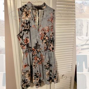 High neck, open back floral romper!